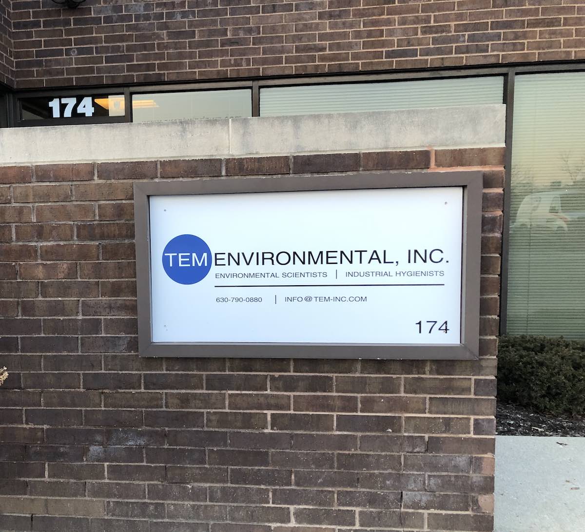 image of TEM Environmental sign on front of office